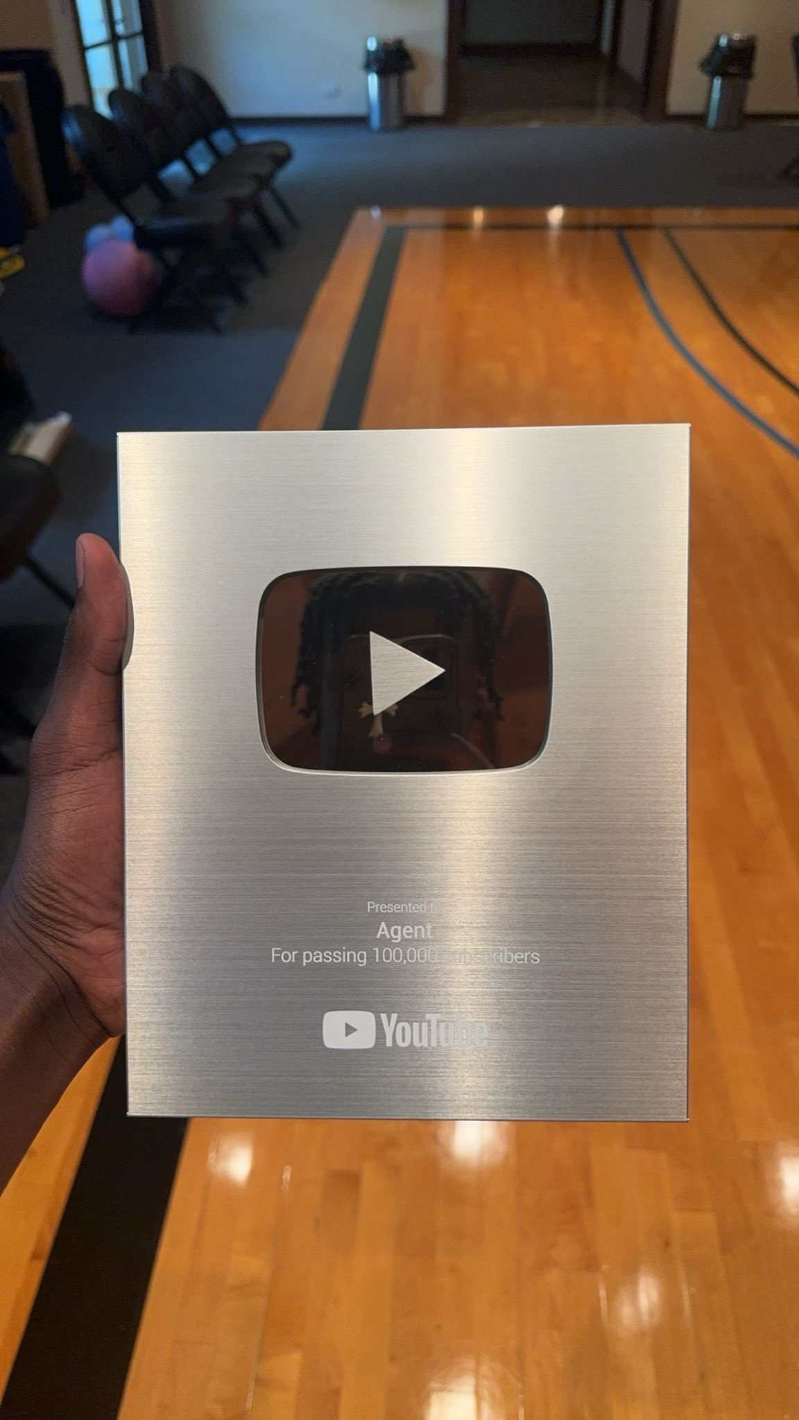 YouTube plaque presented to Agent for passing 100,000 subscribers